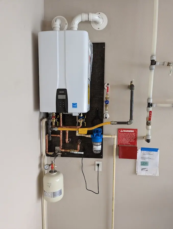 Professional plumber installing copper piping in a Clifton Heights home